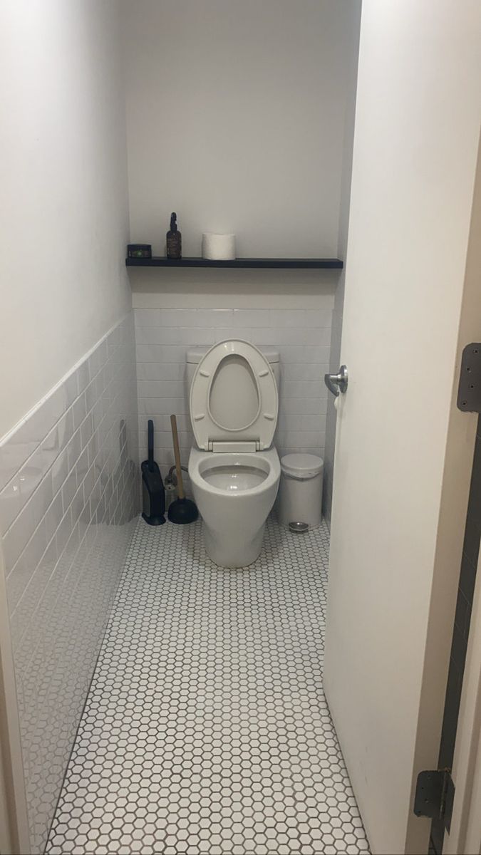 Restroom with hexagon tile floor